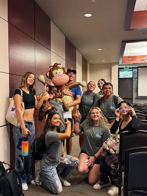 Student editor celebrating after finishing a spread